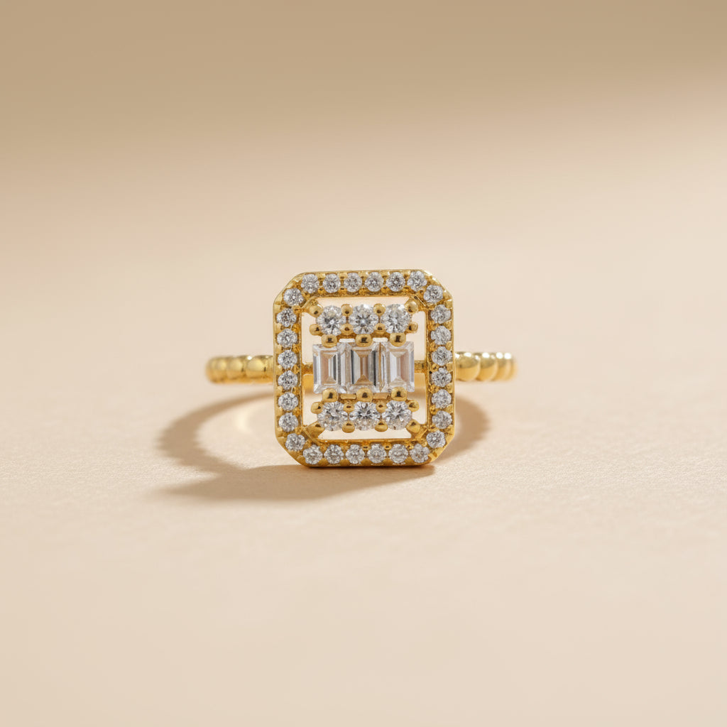 Gold ring with diamond accents on a beige background