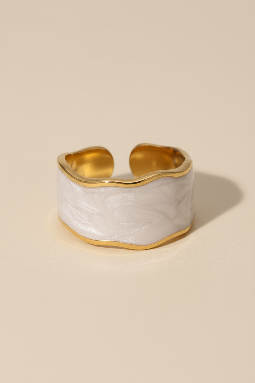 Gold and white textured RING bracelet on a beige background