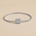 Silver bracelet with diamond accents on a beige background