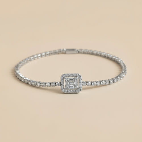 Silver bracelet with diamond accents on a beige background