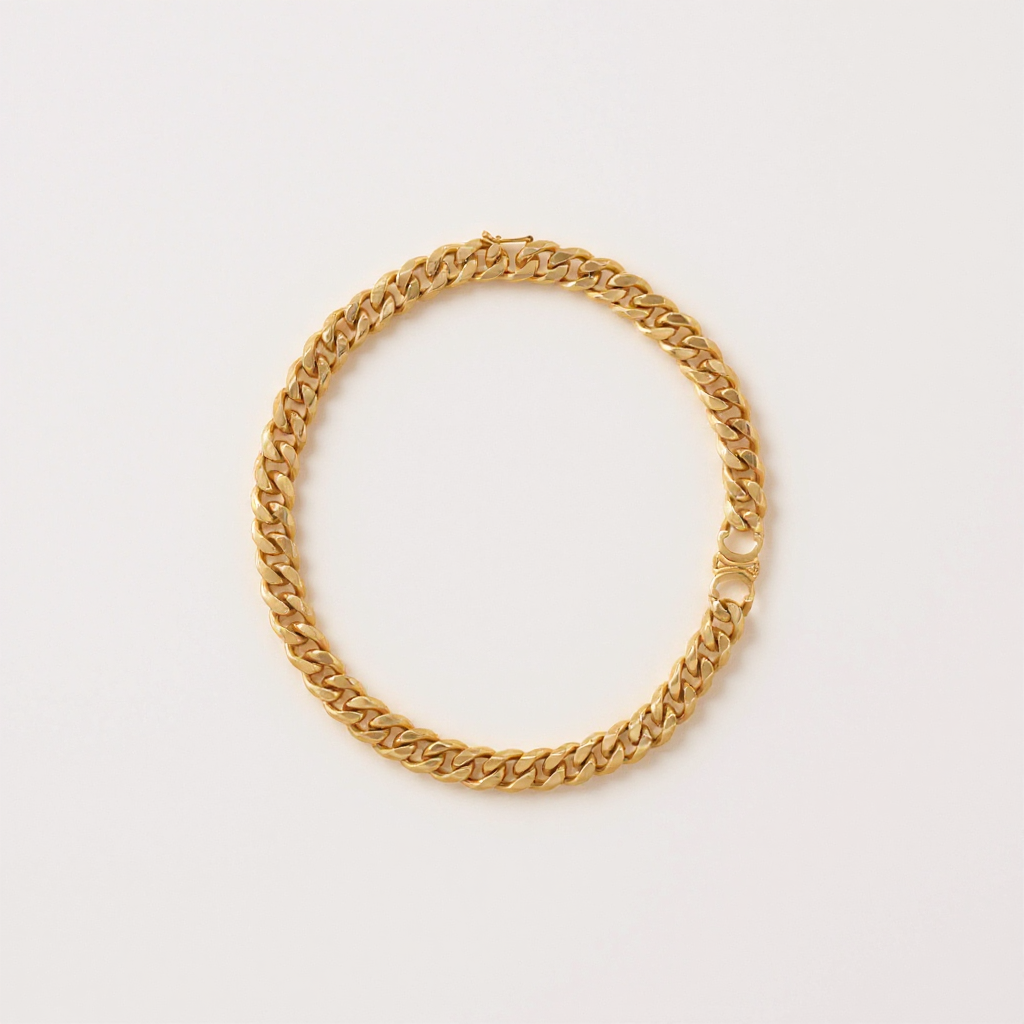 Gold Cuban Chain Necklace on a light gray background
