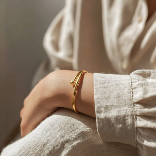 Person wearing the gold Nailhead Bracelet