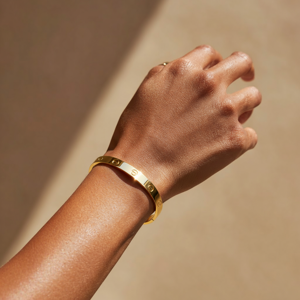 woman wearing the gold Signature Screw Bracelet
