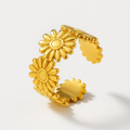 Golden Daisy Ring on a light gray background