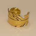 Golden Leaf Bangle on a beige background