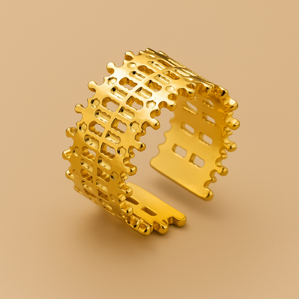 Lattice Gold Ring on a beige background