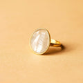 Lunar Glow Gemstone Ring on a beige background