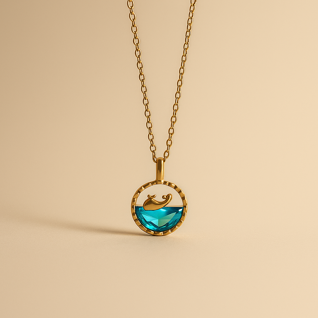 Gold necklace with a Ocean pendant on a beige background
