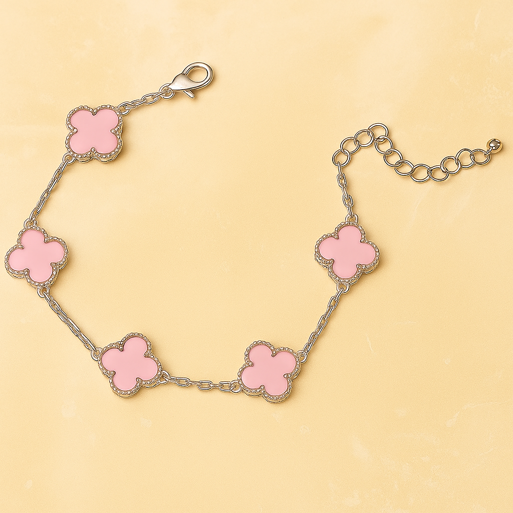 Silver Bracelet with pink Clover shape links on a beige background