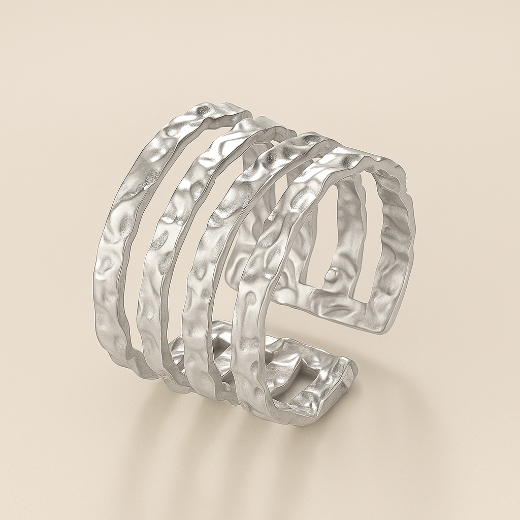 Silver ring on a beige background