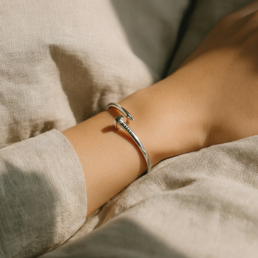 Person wearing a silver bracelet 