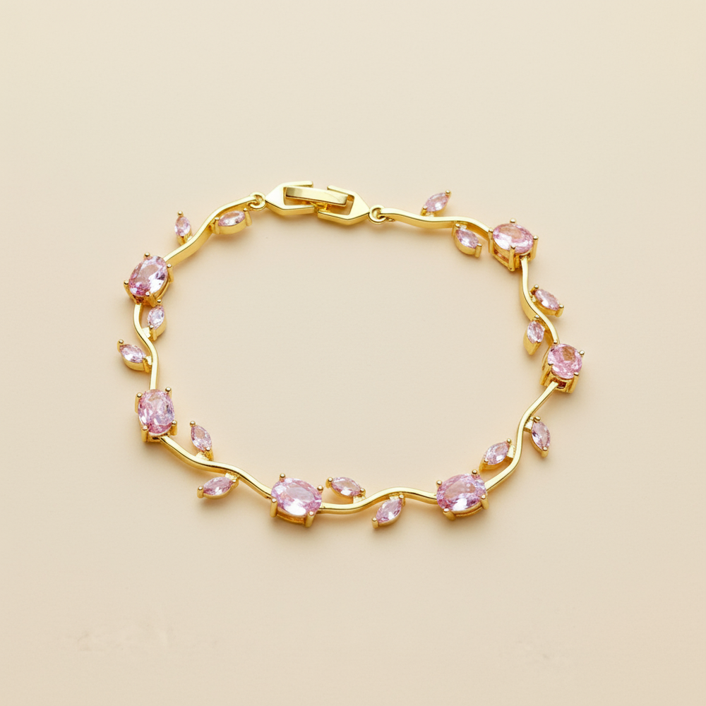 Gold bracelet with Rose gemstones on a beige background