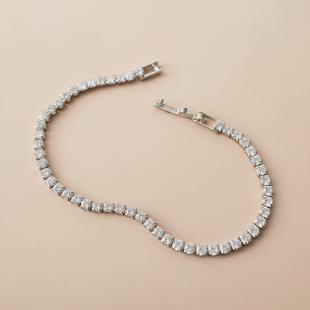 Silver bracelet with clear stones on a beige background