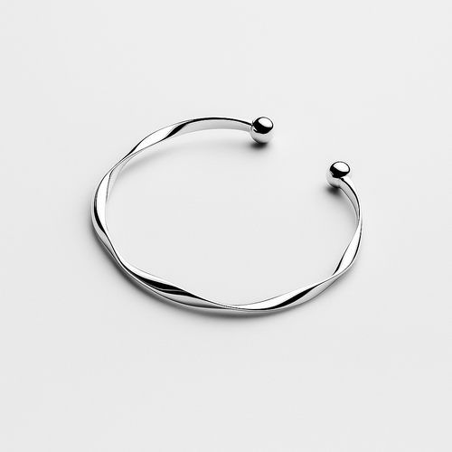 Silver bracelet on a light gray background